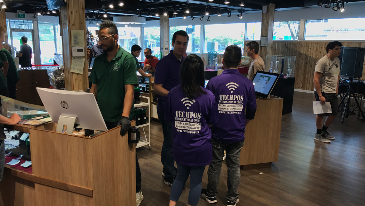 TechPOS team assisting inside a Canadian cannabis dispensary with POS system setup