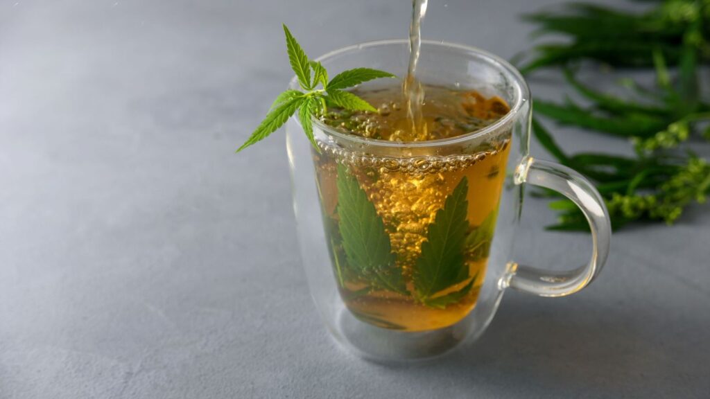 cannabis tea being poured into a glass